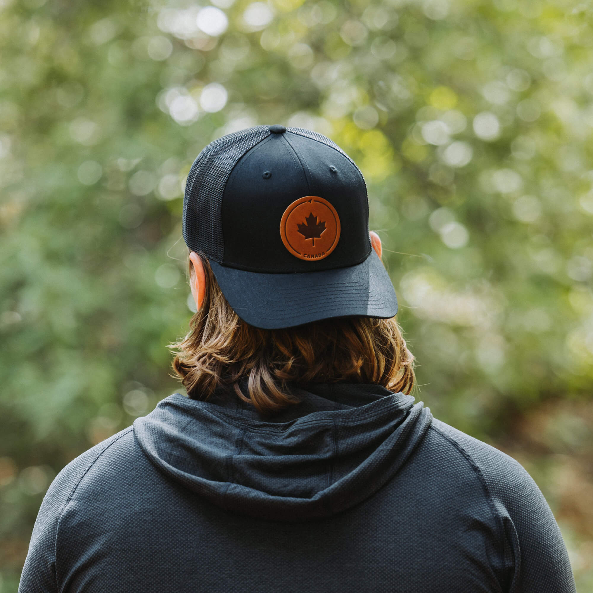 Black trucker hat with full-grain leather patch of Maple Leaf | BLACK-002-001, CHARC-002-001, NAVY-002-001, HGREY-002-001, MOSS-002-001, BROWN-002-001, RED-002-001