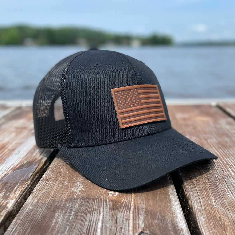 American flag trucker hat with a US flag leather patch