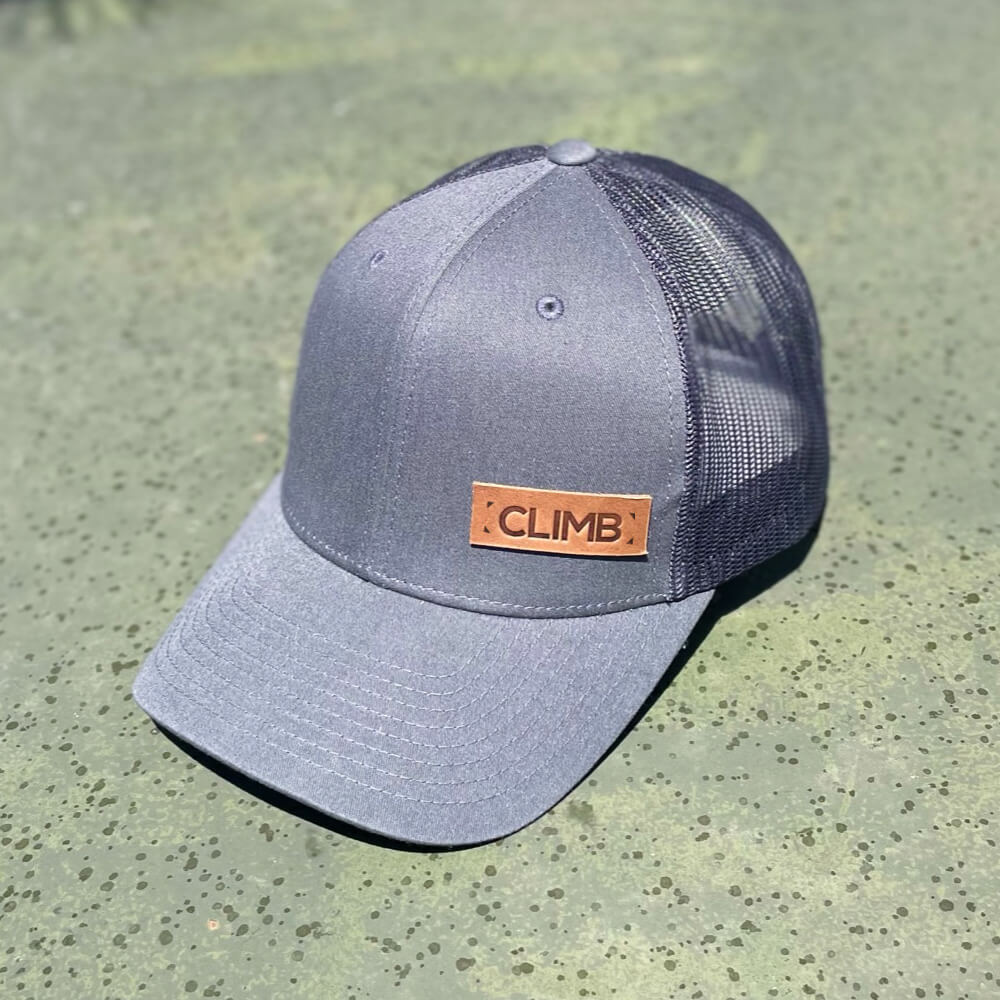Charcoal trucker hat with full-grain leather patch of Custom Text | BLACK-001-001, CHARC-001-001, NAVY-001-001, HGREY-001-001, MOSS-001-001, BROWN-001-001