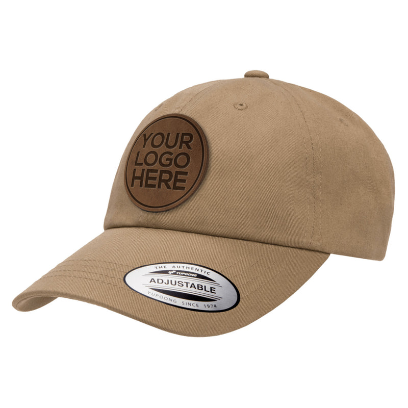 Custom leather patch dad hat with "Your Logo Here" patch on white background