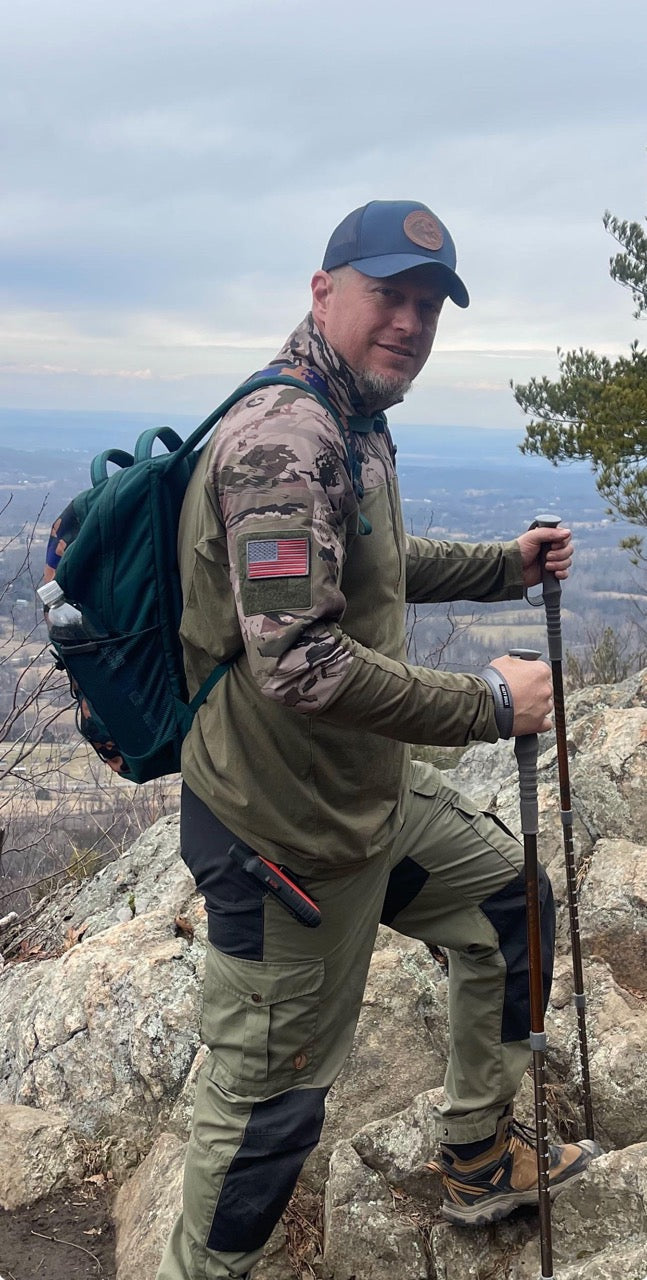 hiking trucker hat with a leather patch, work on a mountain hike