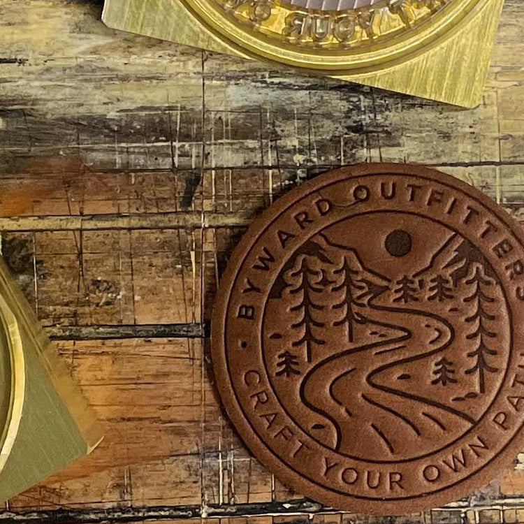 Heat-stamped leather patch with custom brass stamp on trucker hat