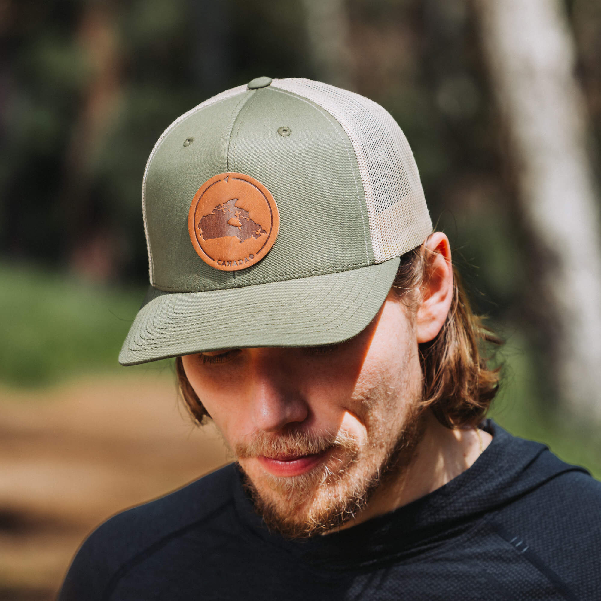 Moss Green and khaki trucker hat with full-grain leather patch of Canada | BLACK-002-002, CHARC-002-002, NAVY-002-002, HGREY-002-002, MOSS-002-002, BROWN-002-002, RED-002-002