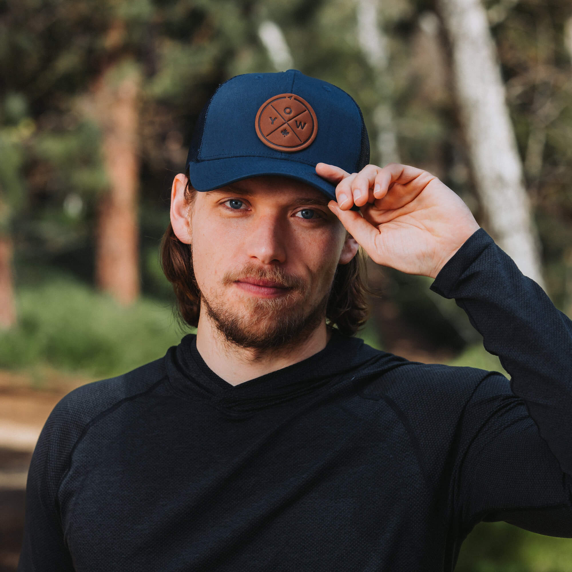 Navy trucker hat with full-grain leather patch with YOW embossing | BLACK-002-008, CHARC-002-008, NAVY-002-008, HGREY-002-008, MOSS-002-008, BROWN-002-008