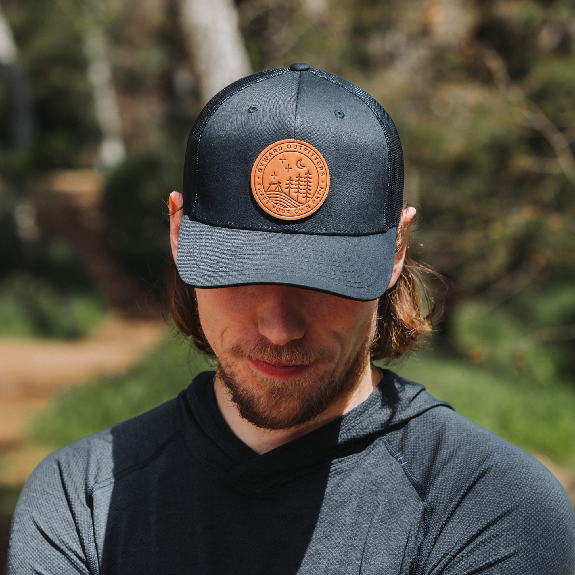 Black trucker hat with full-grain leather patch of Stellar Night | BLACK-005-001, CHARC-005-001, NAVY-005-001, HGREY-005-001, MOSS-005-001, BROWN-005-001